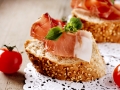 Jamon. Slices of Bread with Spanish Serrano Ham. Prosciutto