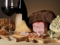 Exquisite still life of wine, cheese and meat products