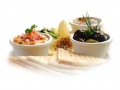 Sumptious platter of flat breads served with red pepper hummus dip, crab dip, olives and grilled haloumi cheese. Shallow DOF.